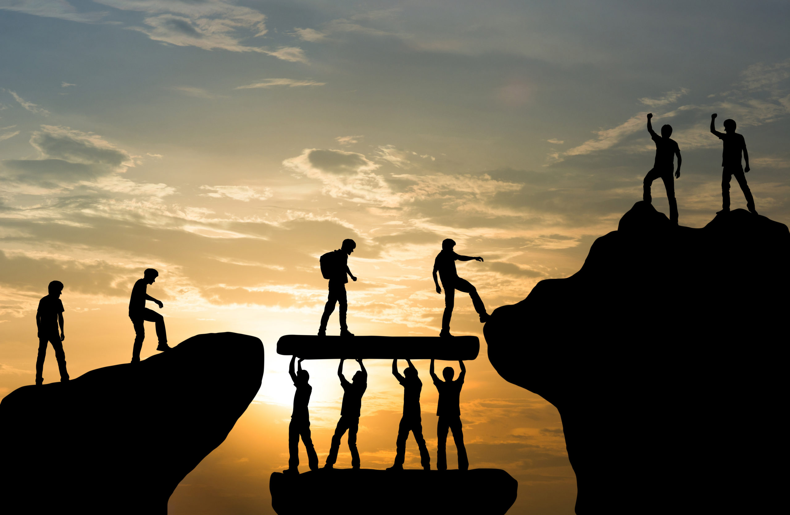 Group of people on peak mountain climbing helping team work , tr